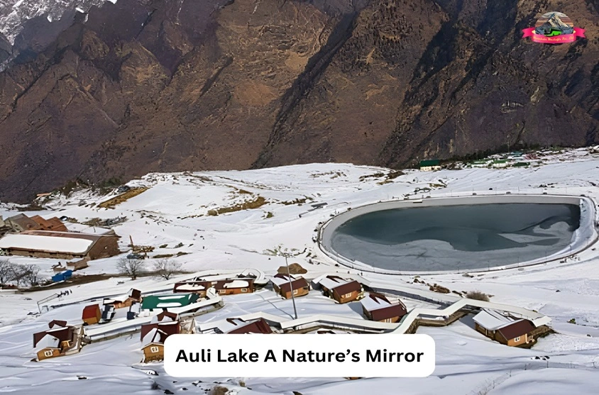 Snow covered auli with beautiful view of lake and text on it saying auli a nature mirror